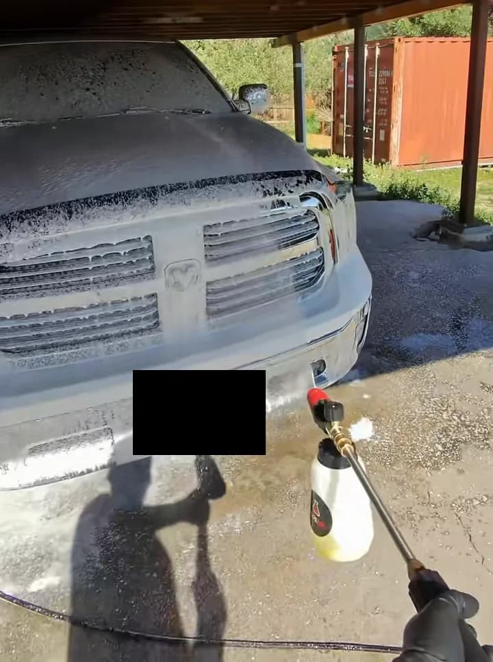 White Ram covered in foam during a residential mobile detail