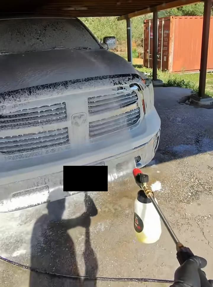 White Ram covered in foam during a residential mobile detail