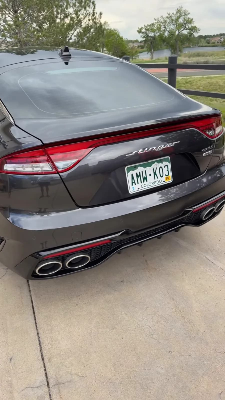 Finished black Kia Stinger photographed from the rear