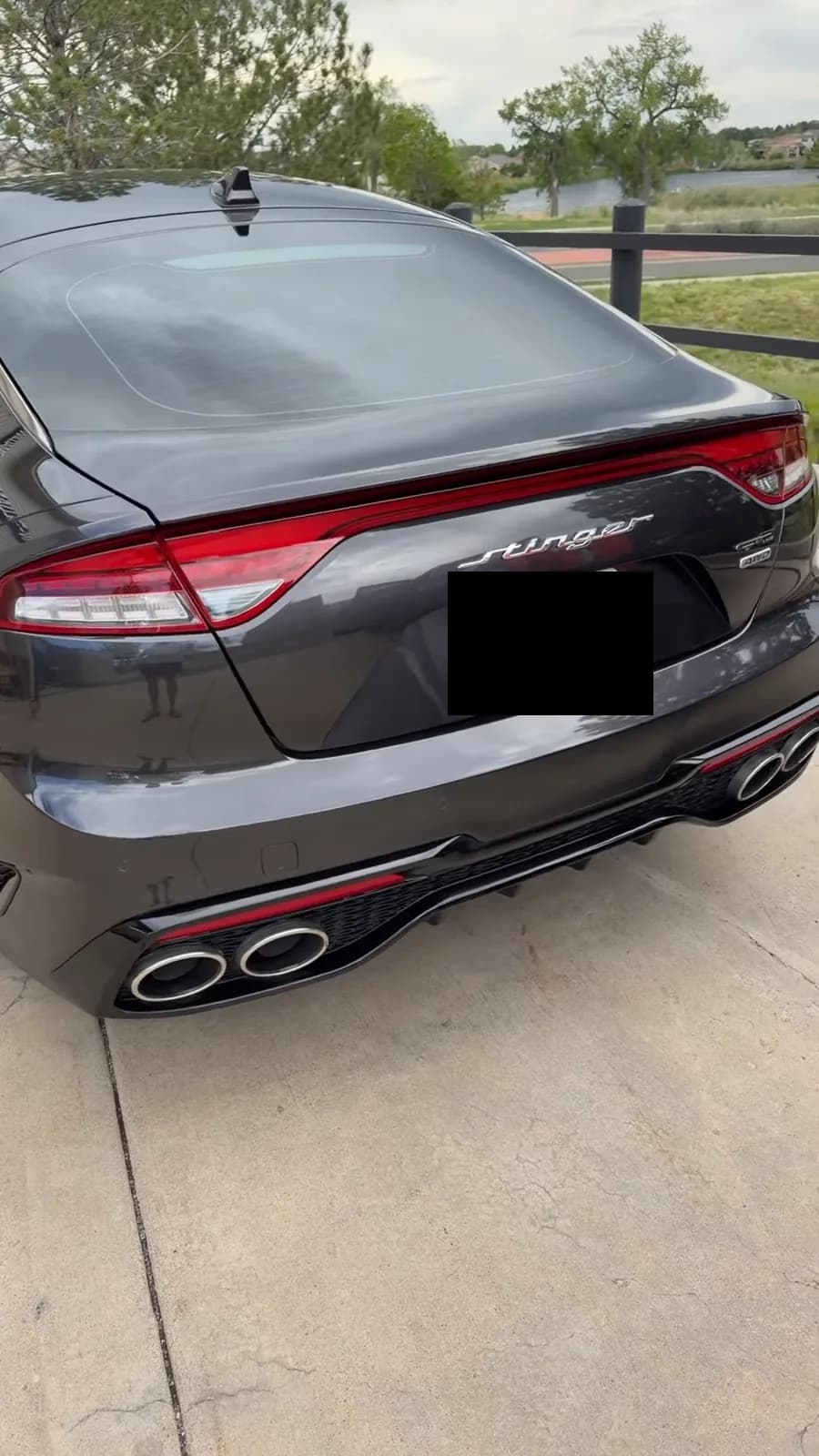 Finished black Kia Stinger photographed from the rear